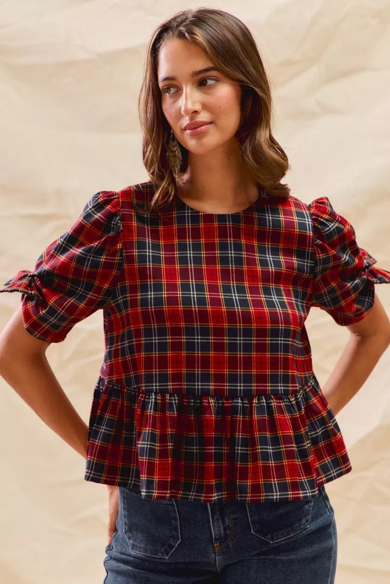 Red plaid peplum top with ribbon bow cuffs and short puff sleeves