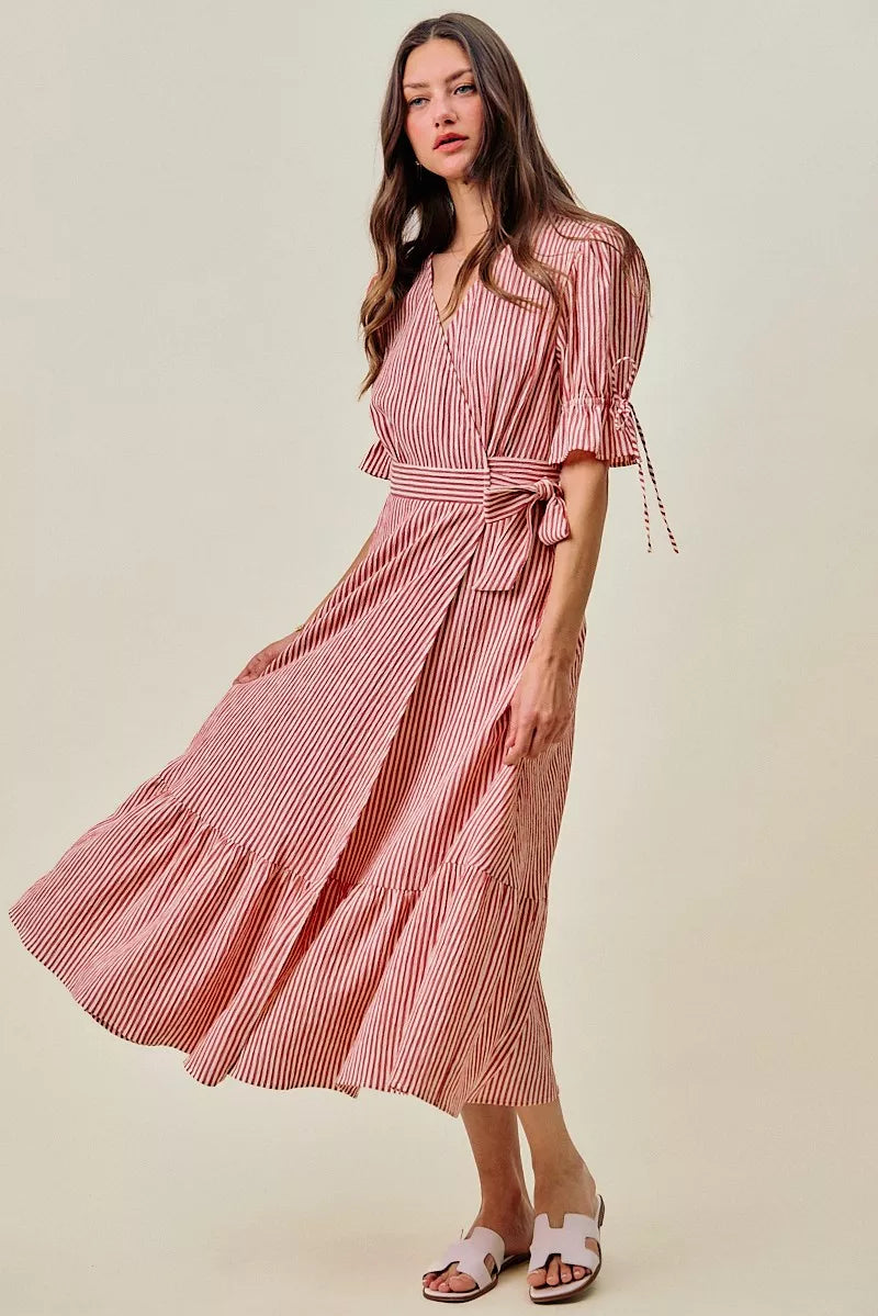Red striped wrap midi dress with fluttery ruffle sleeves and tiered skirt