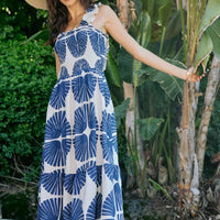 Sleeveless smocked bodice tiered midi dress with navy abstract floral print, lined