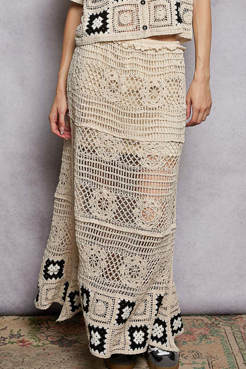 Crochet maxi skirt in natural with textured stitch panels and black granny-square hem