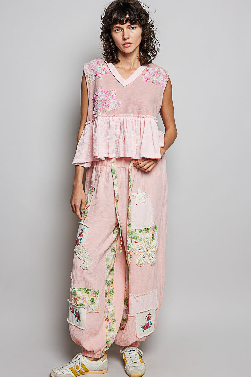 Powder pink floral patch ruffled sleeveless top with tiered peplum and V-neck