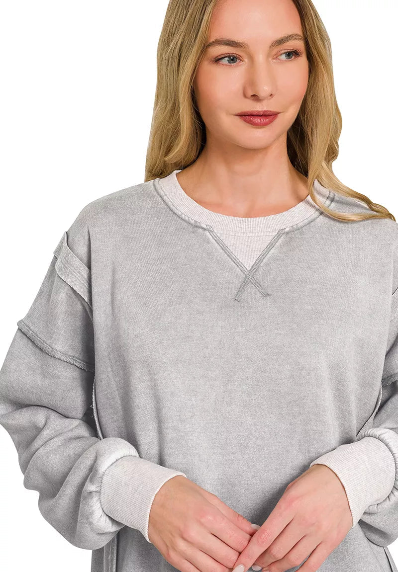 Gray acid-washed fleece pullover with contrast-trim neckline and long sleeves
