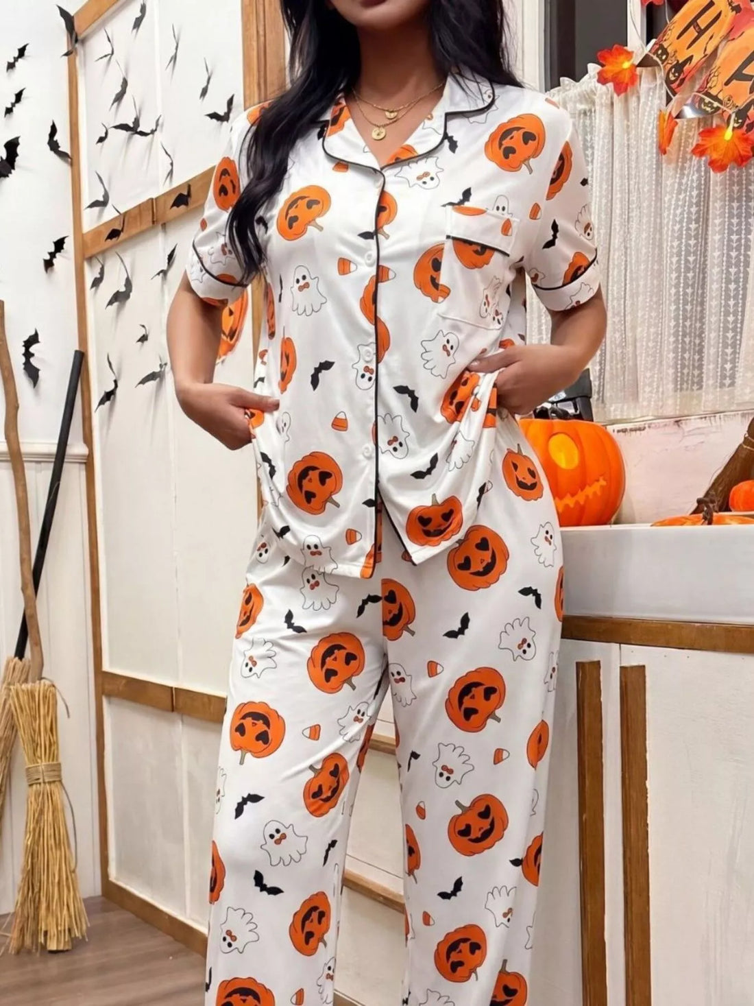 Halloween pajama set: white button-up top and pants with orange jack-o&