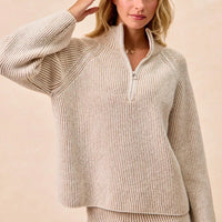 Taupe two-tone ribbed knit quarter-zip collared sweater top, angled side view