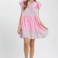 Pink tiered mini dress with flutter sleeves and V-neck, striped hem and dot print