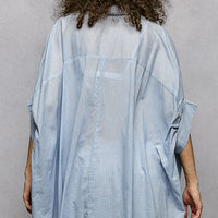 Sky blue button-down embroidered shirt back with high-low hem