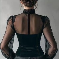 Black velvet sheer-sleeve blouse, back view with lace-trim high neckline and corset fit