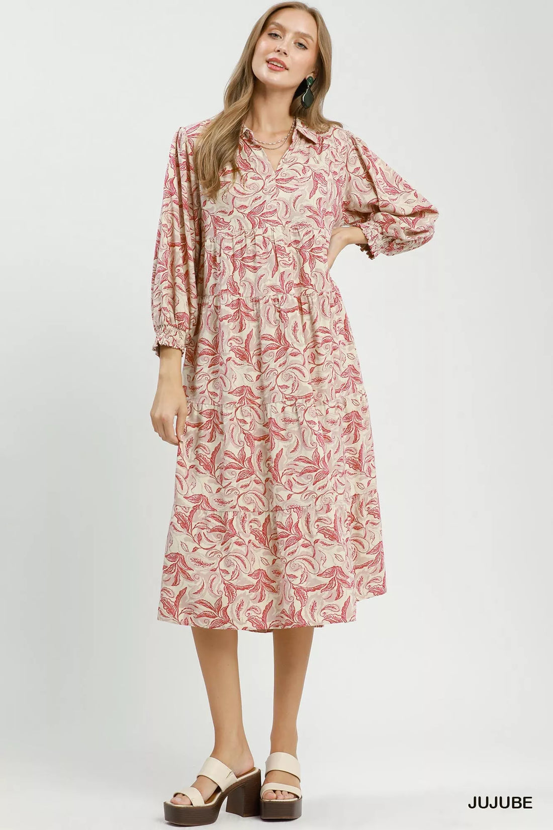 Tiered midi dress with pink botanical print, long sleeves, and button-front neckline