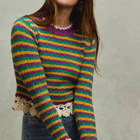 Striped cropped knit top with purple neckline and crochet lace cuffs and hem