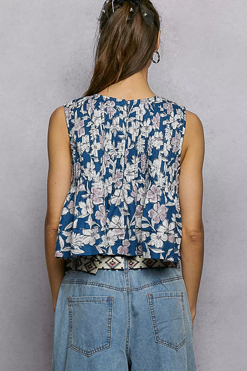 Navy floral sleeveless cropped tank, back view, with gathered pintuck seams