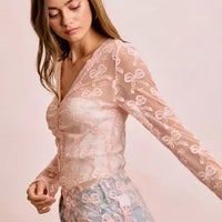 Dusty rose sheer mesh cardigan top with bow pattern, V-neck, long sleeves and button placket