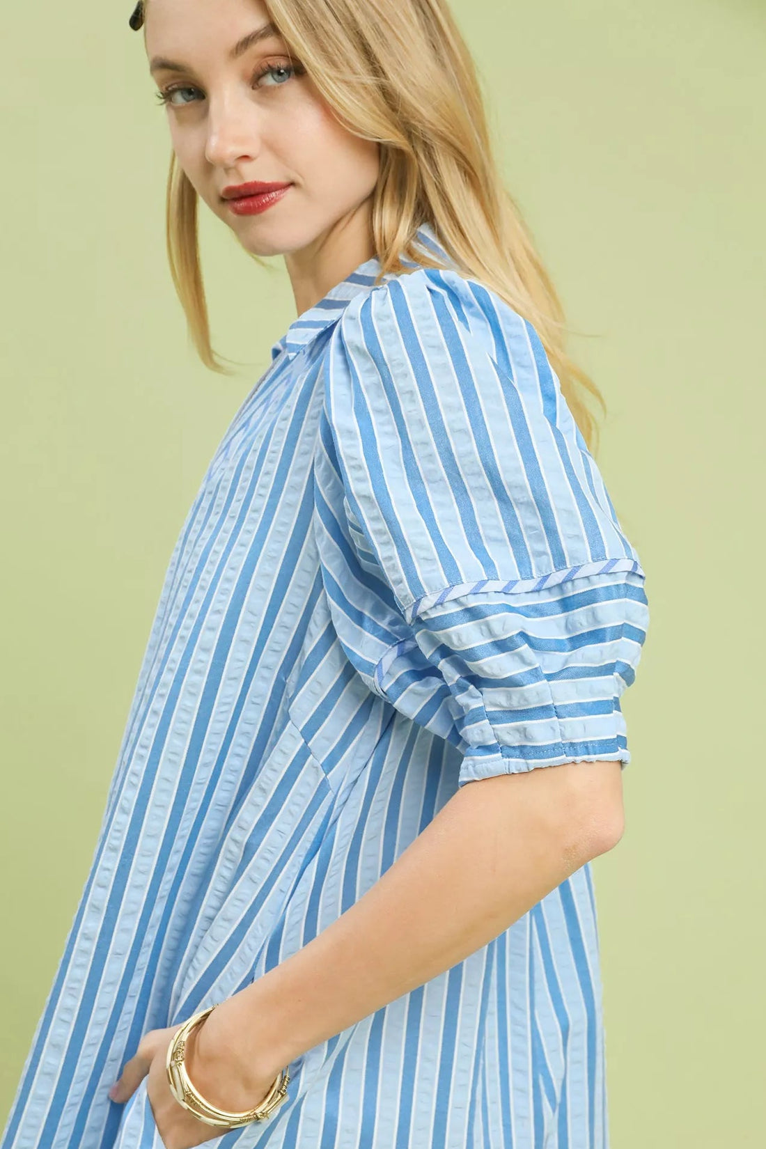 Striped midi dress sleeve with ruffled puff cuff in blue-and-white.