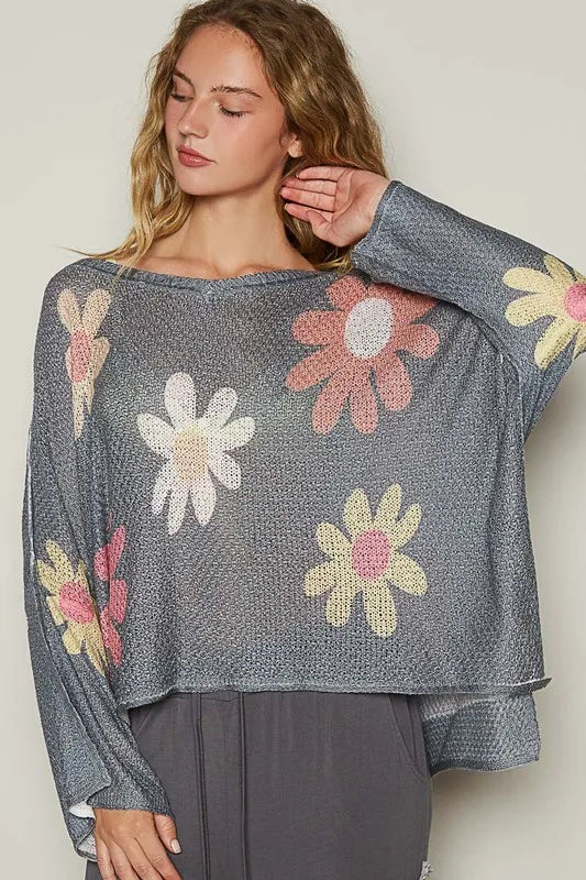 Dark charcoal knit top with long dropped sleeves and floral embroidery-style print