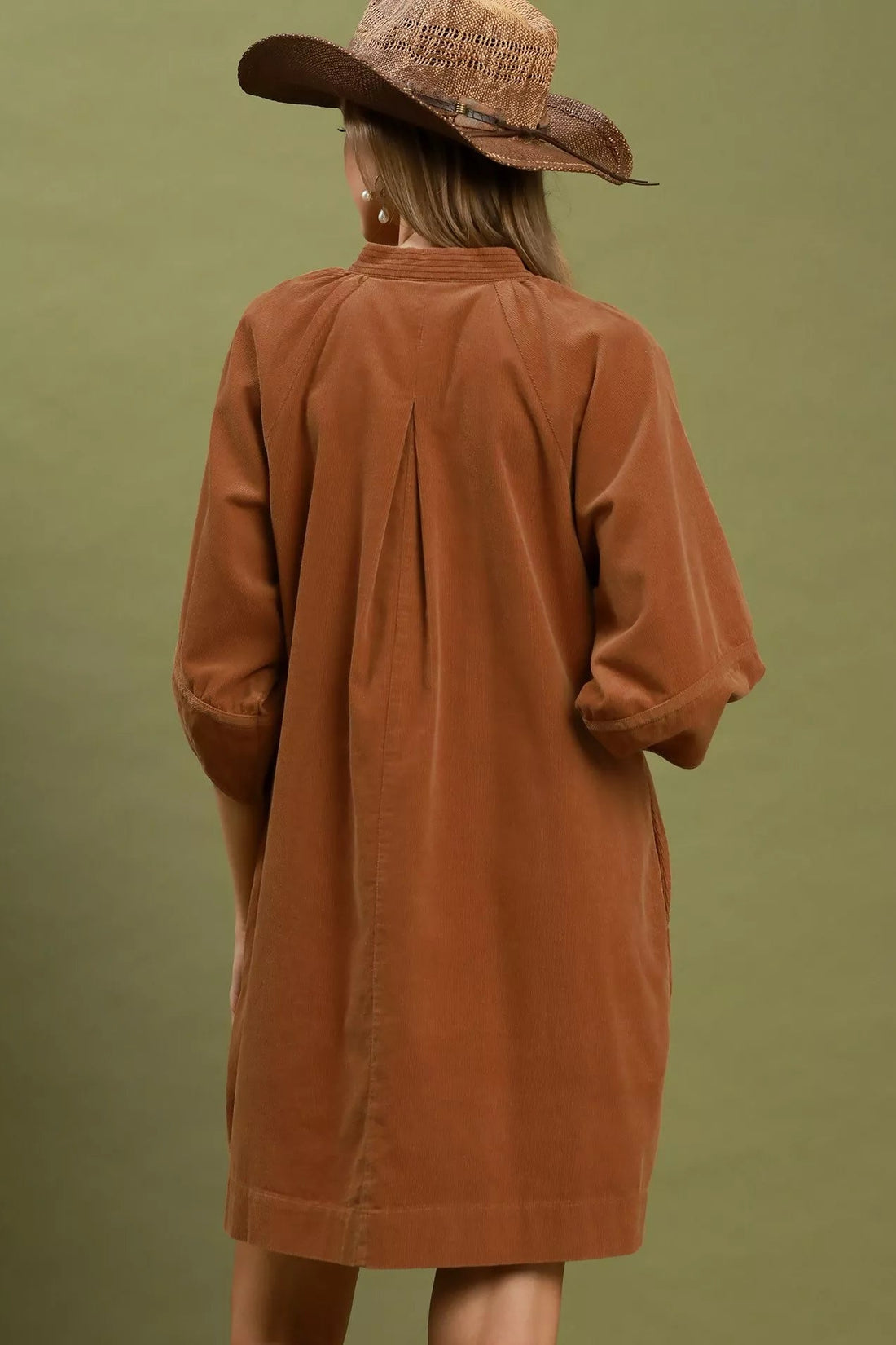Camel brown corduroy shift dress back view with puff sleeves