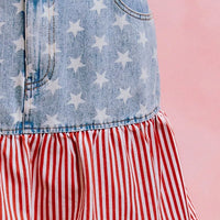 Blue denim skirt with star print, button waistband, and red-and-white striped ruffle tier.