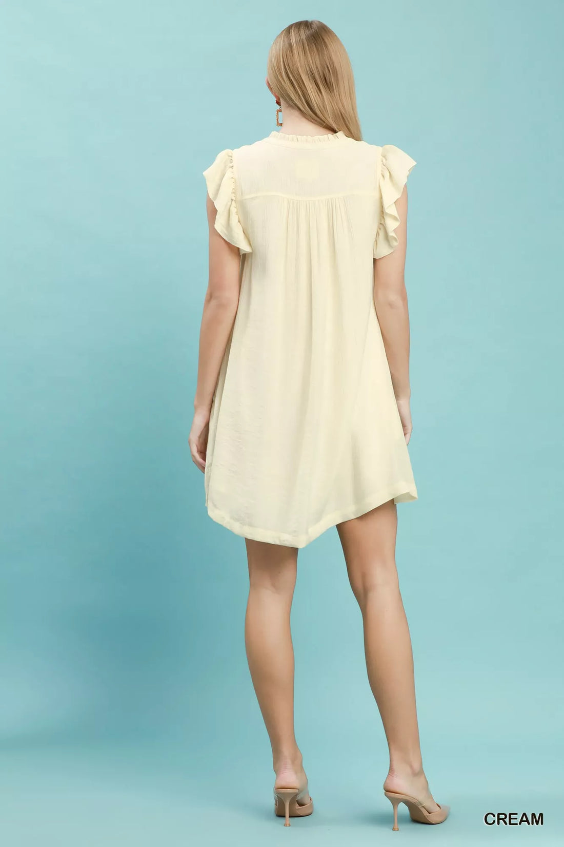 Cream ruffle-sleeve henley shift dress, back view with button placket detail