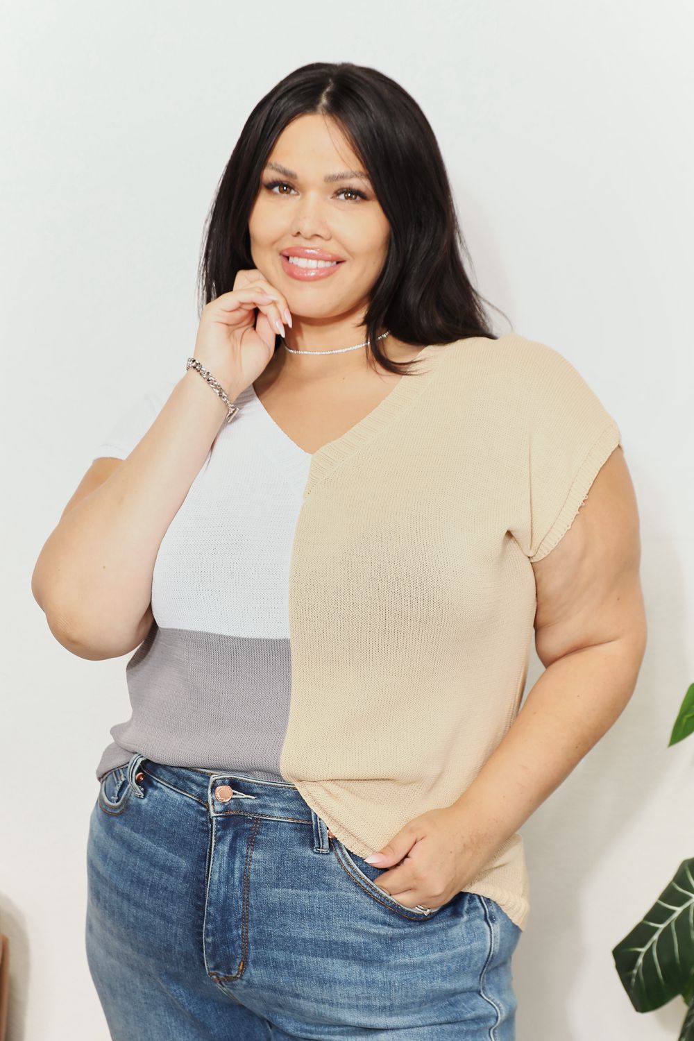 Color-block knit V-neck top with short sleeves; beige and white front panel with gray side