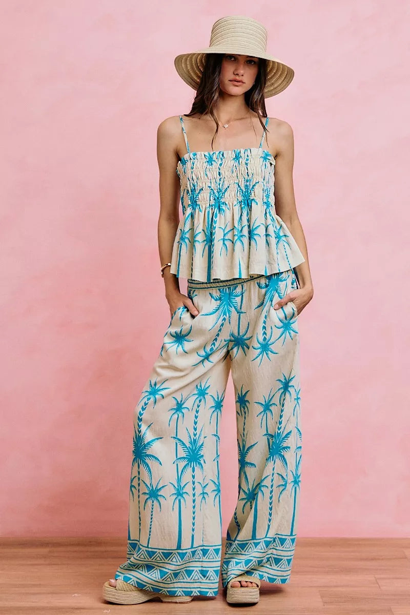 Blue palm-print smocked cami top with adjustable straps and tiered peplum hem