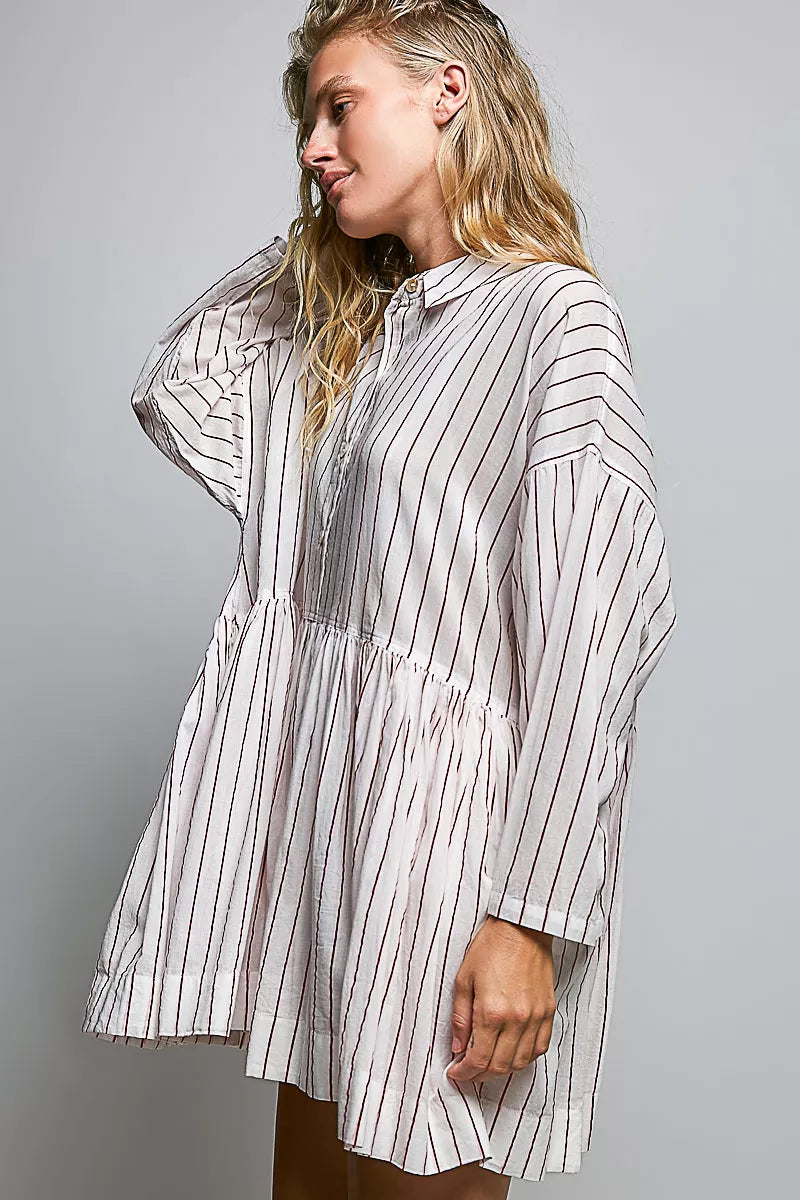 Side view of striped shirt dress with collared button placket, gathered waist, long sleeves