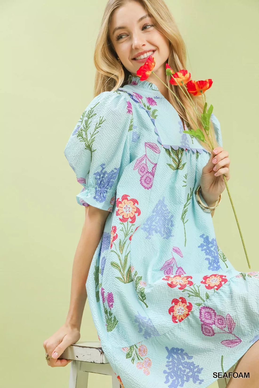 Seafoam floral V-neck dress with gathered shoulders and colorful bouquet-like print