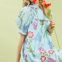 Seafoam floral V-neck dress with gathered shoulders and colorful bouquet-like print