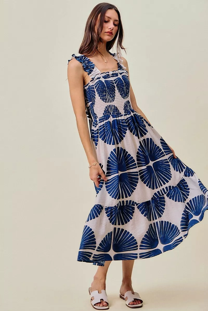 Navy abstract print tiered midi dress with smocked bodice and ruffled cap sleeves