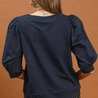 Navy sweatshirt with puffed sleeves, back view, crew neckline