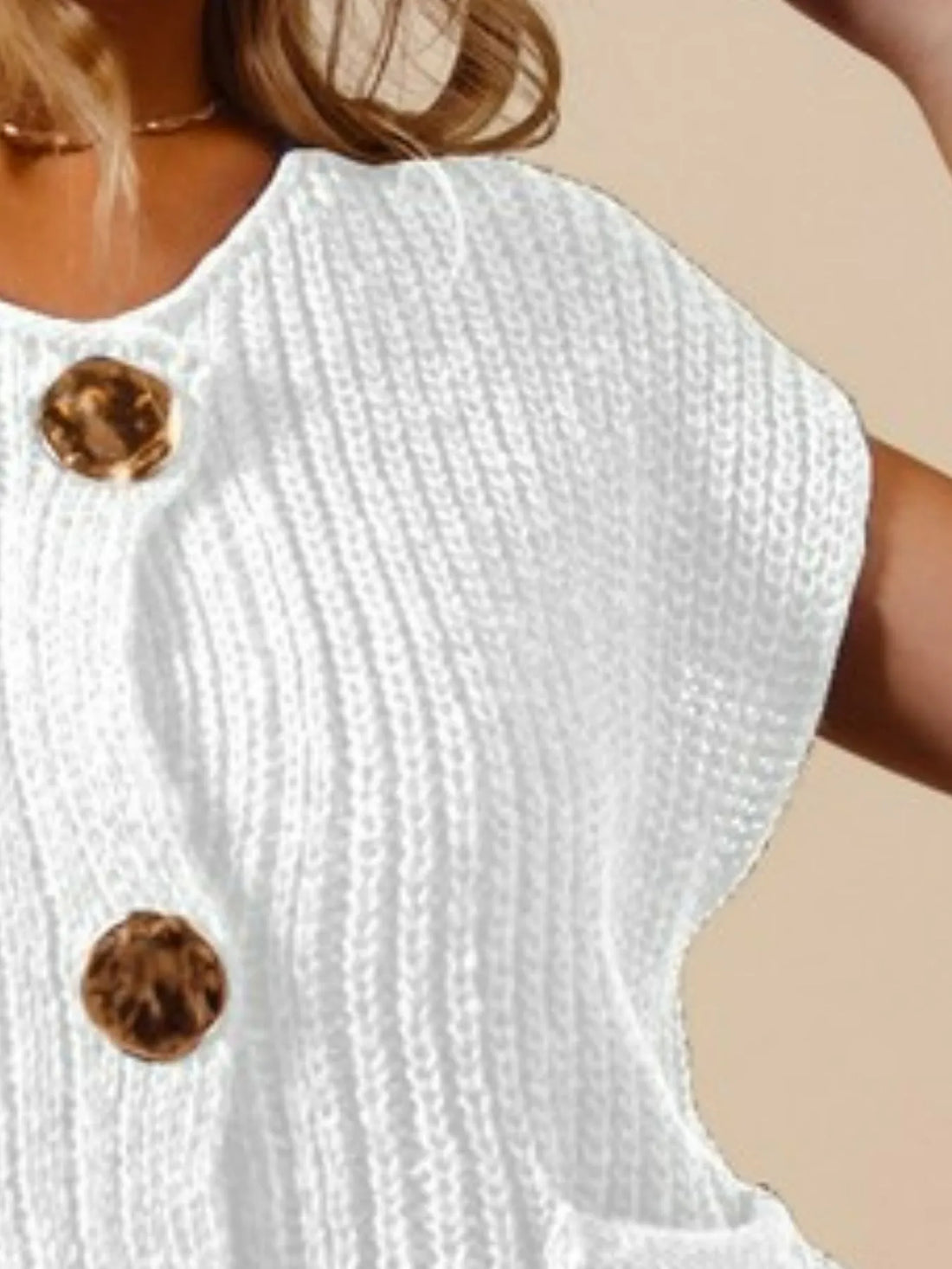 Off-white sleeveless knit sweater vest with big gold-tone metal button front