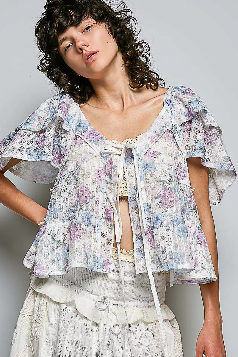 Angle front floral tie-front blouse with lace-trim neckline and tassel ties, off-white print
