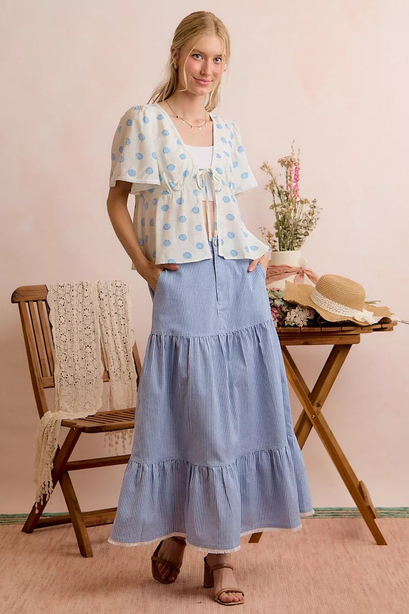 Ivory blouse with blue shell print, center-tie front and flutter sleeves