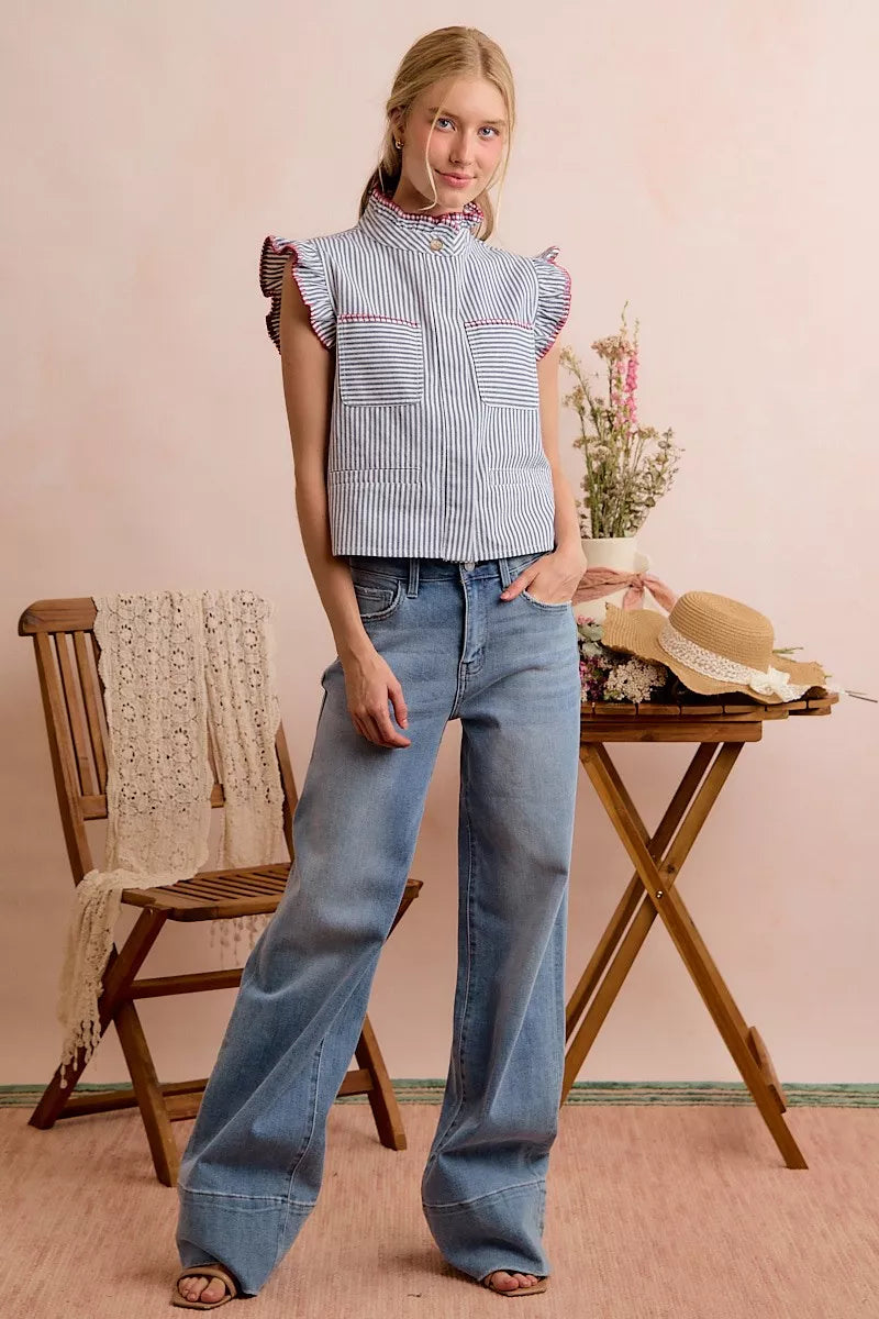 Blue-and-red striped twill sleeveless vest top with ruffled armholes and hidden buttons