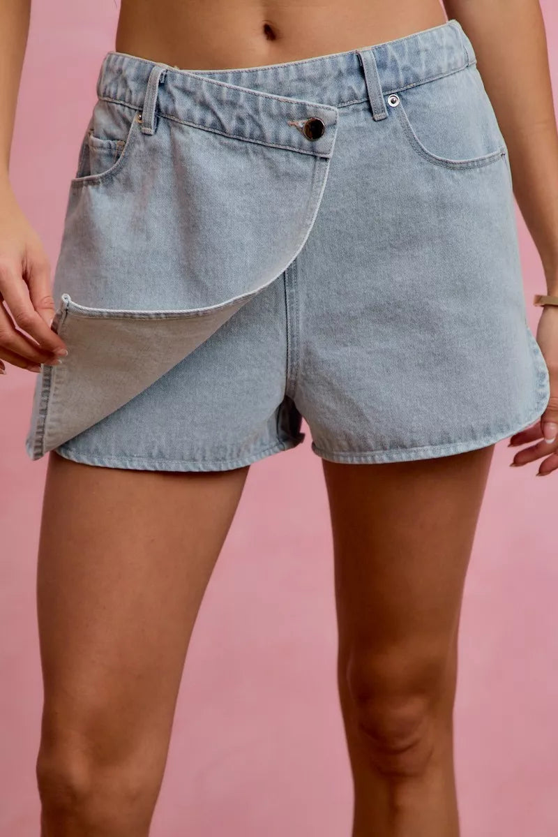 Light blue denim wrap skort with asymmetrical front overlay and side pockets