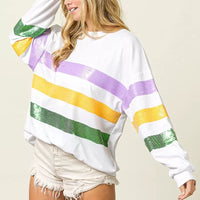 White crew-neck sweatshirt with sequin-striped front in purple, yellow, and green, side