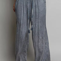 Charcoal wide-leg woven pants with elastic waist and dangling tassel drawstring