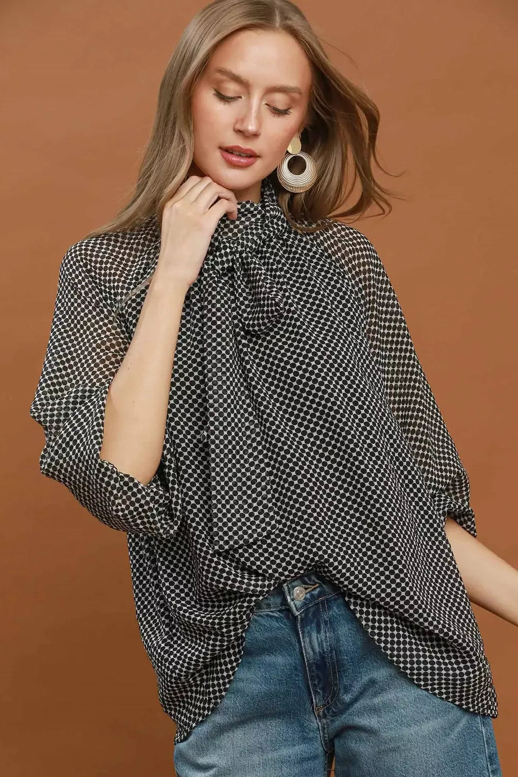 Black and white dot print tie-neck blouse with long sleeves, relaxed fit