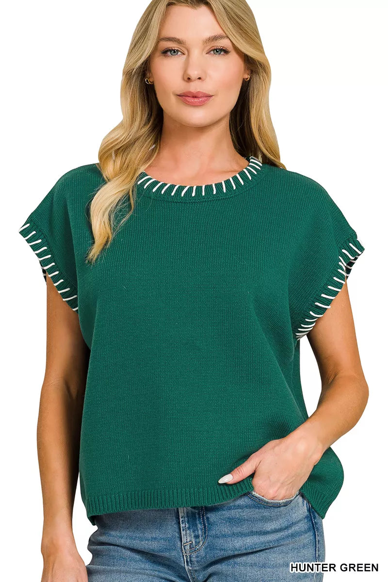 Hunter green oversize sweater with contrast stitch detail at round neckline and sleeve cuffs