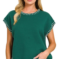 Hunter green oversize sweater with contrast stitch detail at round neckline and sleeve cuffs
