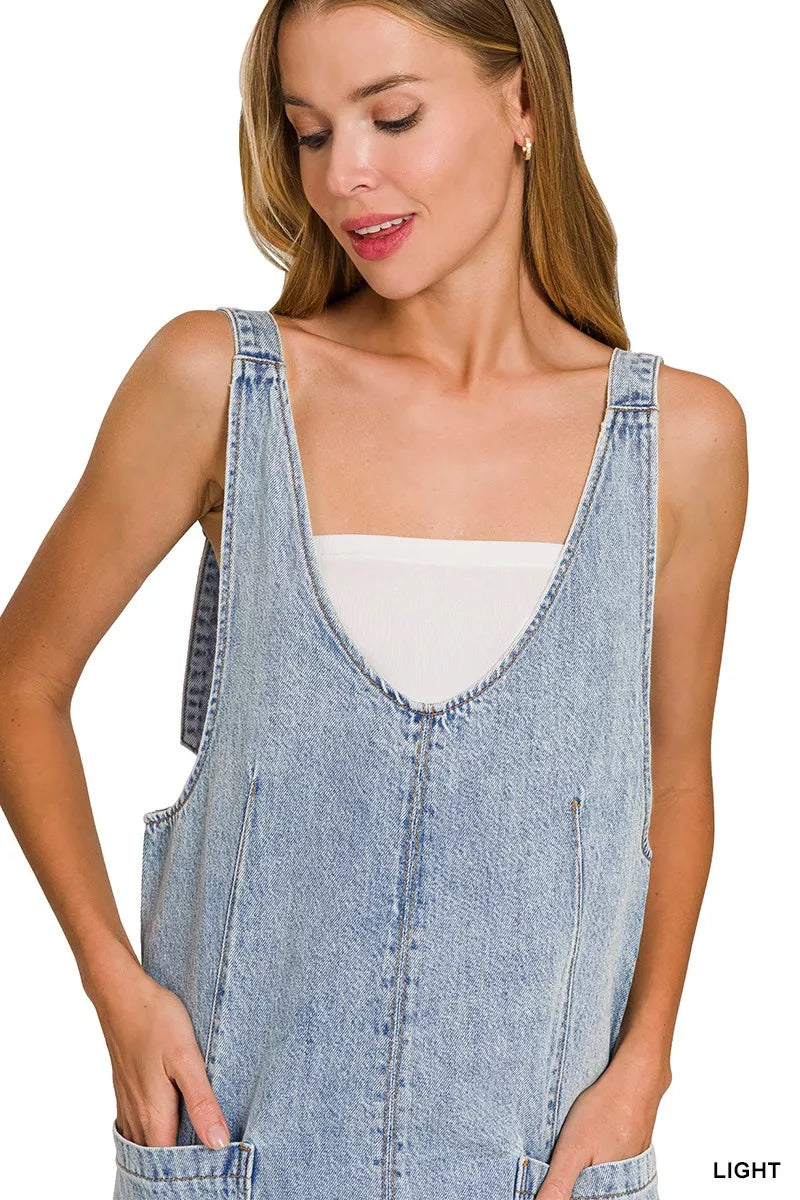 Light wash denim overall dress with square neckline and stitched front panel