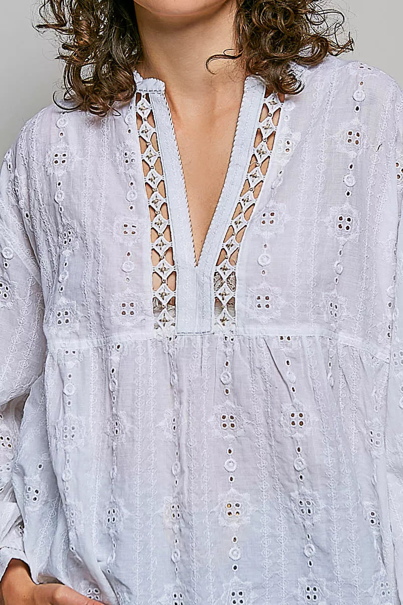 Off-white cotton V-neck blouse with lace-up trim and circular eyelet stitching