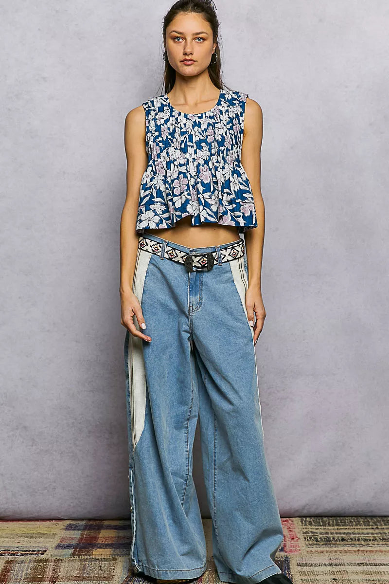 Navy floral cropped pintuck tank with sleeveless round neck and peplum-like hem