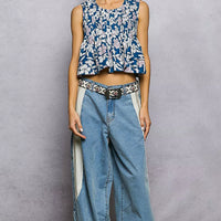 Navy floral cropped pintuck tank with sleeveless round neck and peplum-like hem