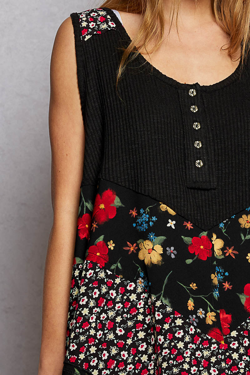 Black ribbed tank top with colorful floral woven patch and scoop neckline