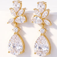 Gold-tone CZ teardrop drop earrings with clustered pear stones and dangling charm