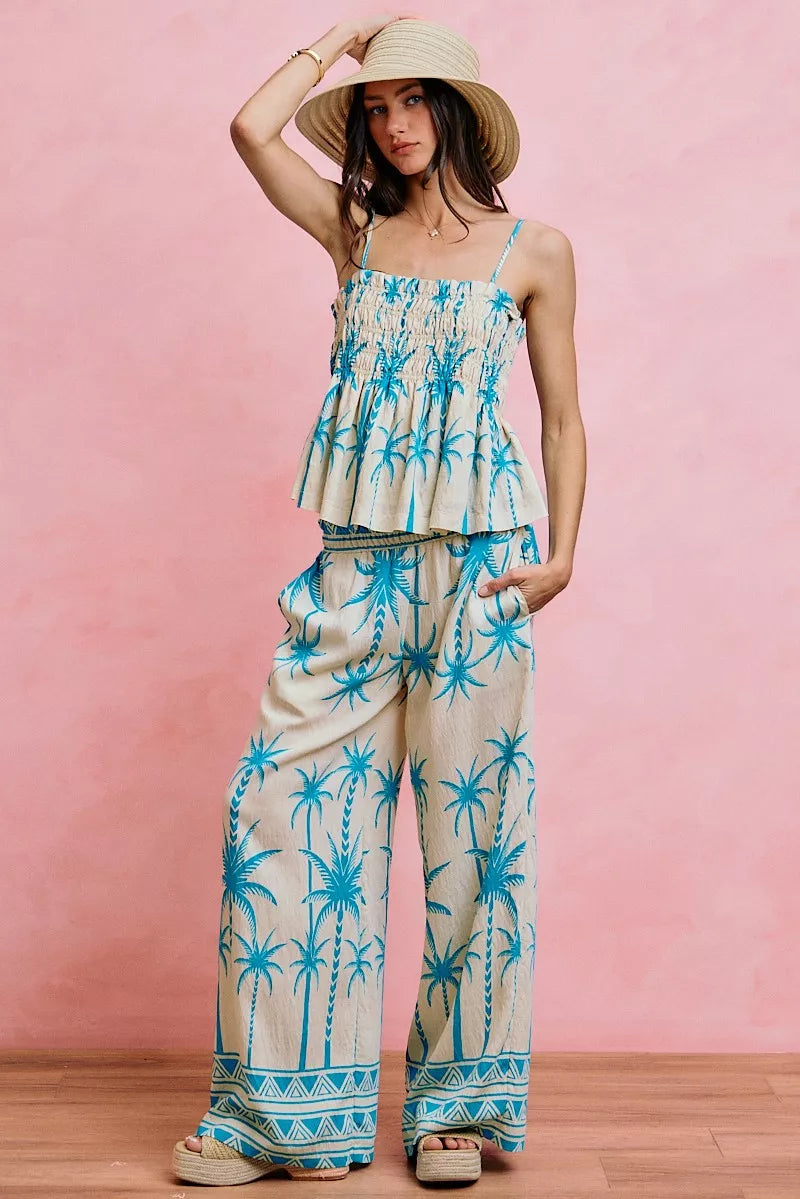 Blue palm-print smocked cami top with adjustable straps and tiered peplum front