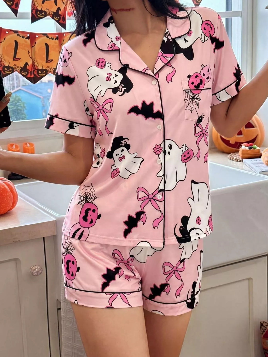 Pink Halloween lounge set with button-down short-sleeve top and matching printed shorts