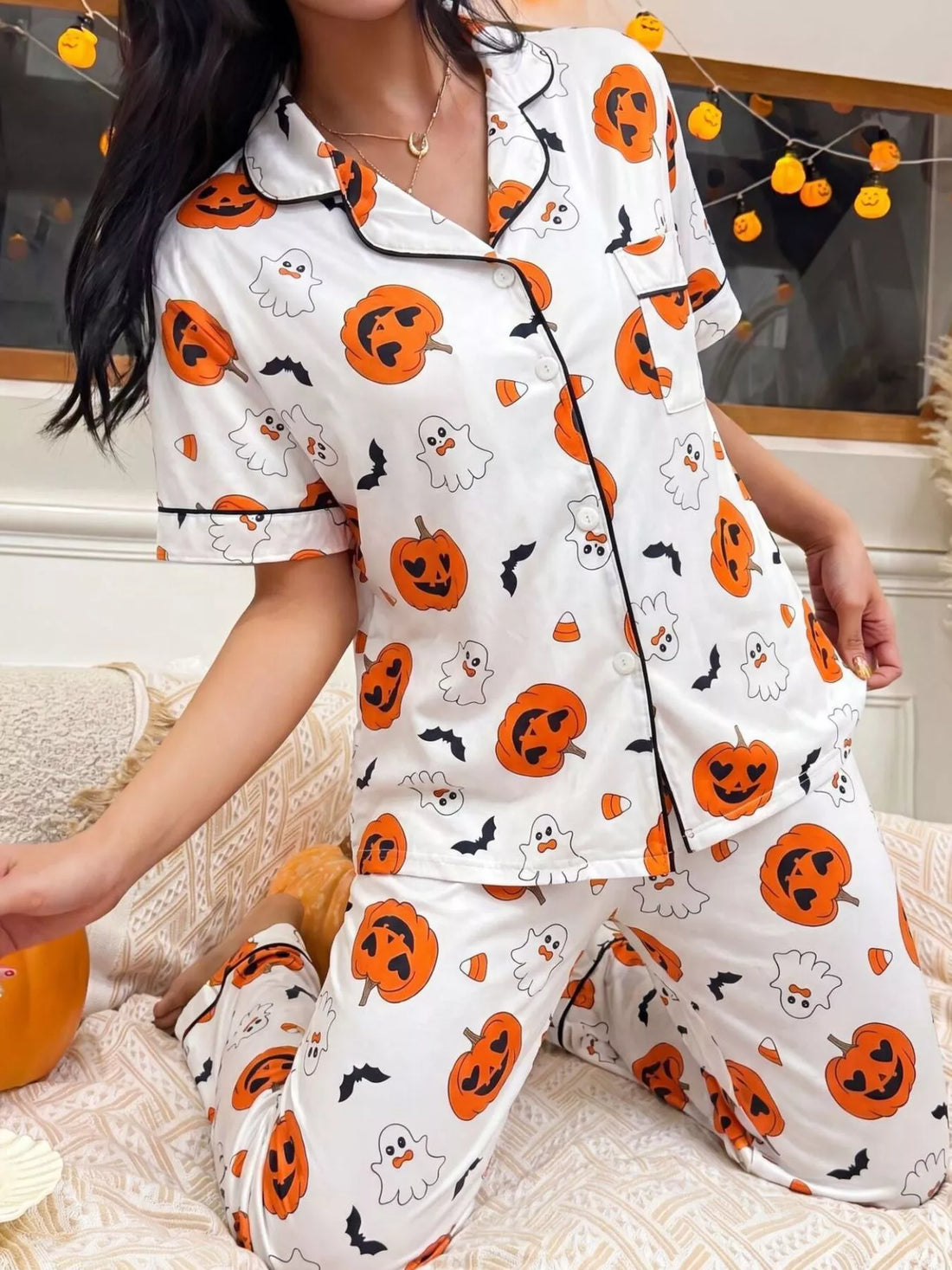 Halloween pajama set: white short-sleeve button-up shirt with pocket and pumpkin prints