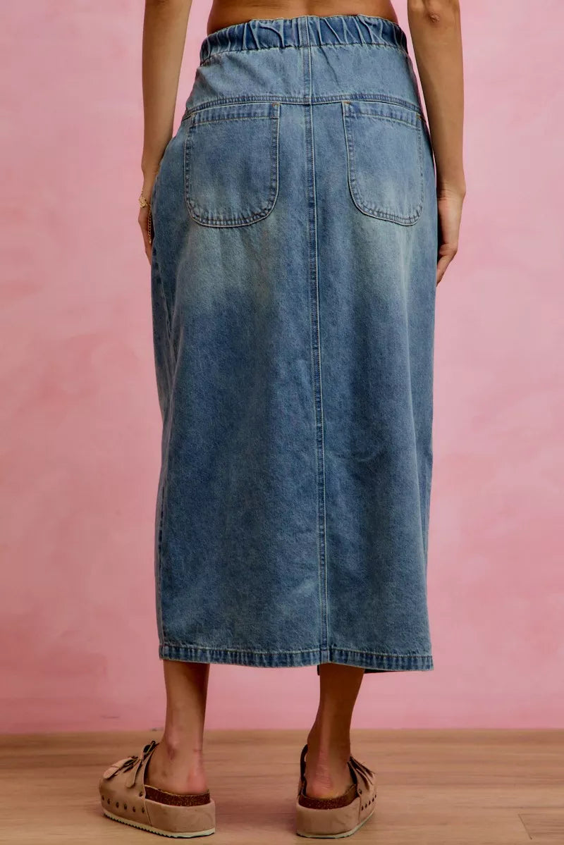 Washed denim midi skirt back view with pleats and patch pockets