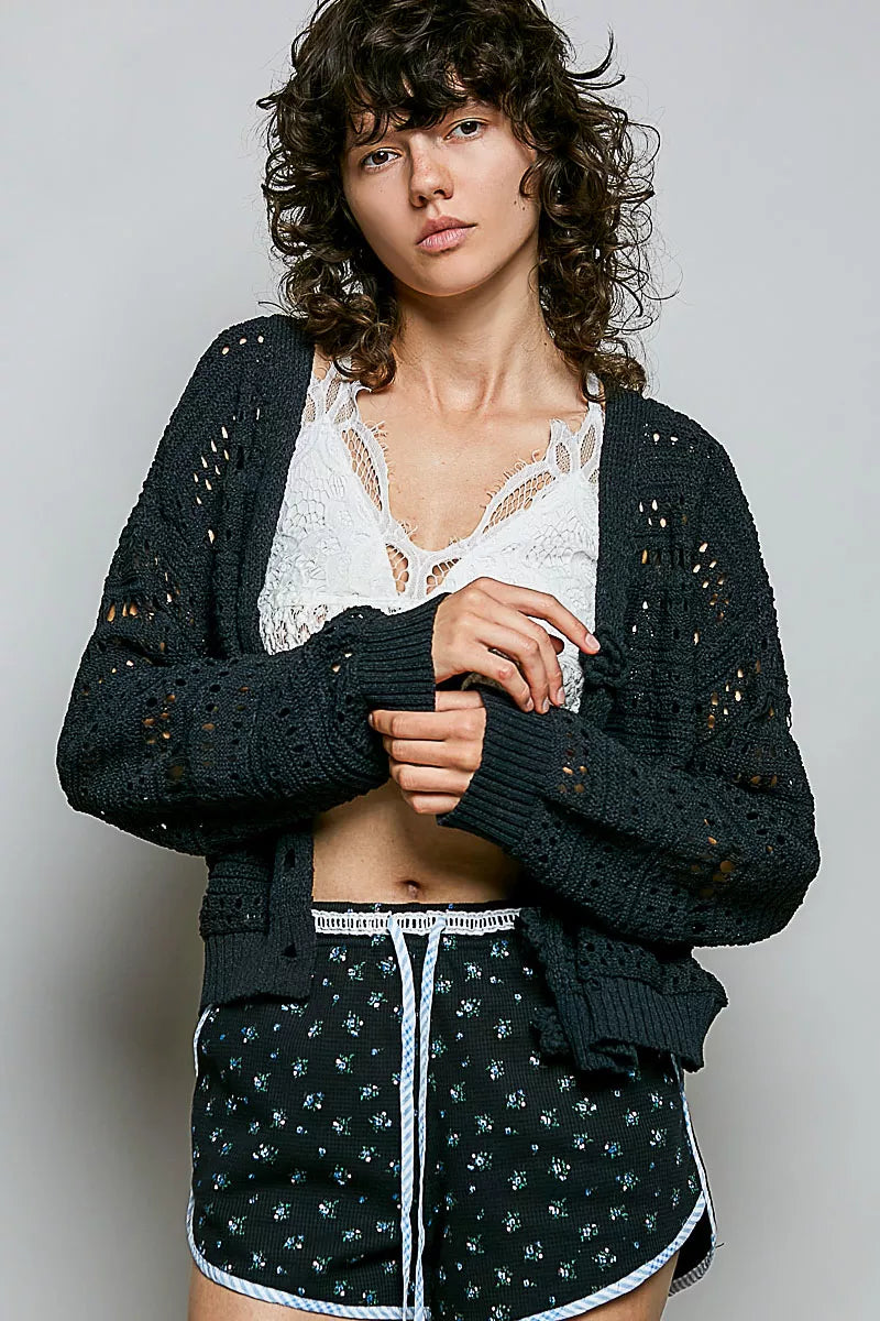 Black open-knit button cardigan with ribbed cuffs and front button placket