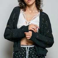 Black open-knit button cardigan with ribbed cuffs and front button placket