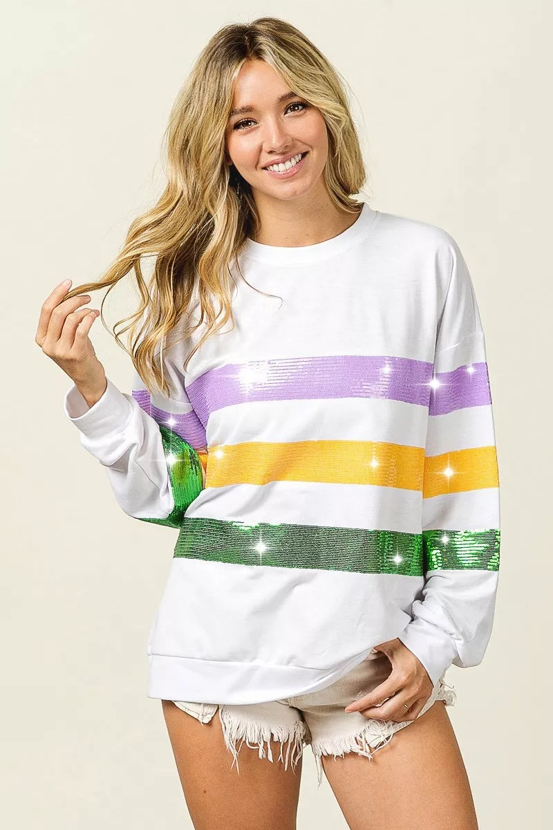 White crew-neck sweatshirt with sequin-striped front in purple, yellow, and green